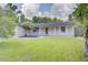 Charming single-story home with a well-manicured lawn and inviting front porch at 422 S Hawthorn Cir, Winter Springs, FL 32708
