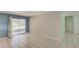Inviting living area with sliding glass doors to the patio and easy access to the kitchen at 422 S Hawthorn Cir, Winter Springs, FL 32708