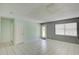 Cozy living area with neutral tones, tiled floors, and natural light from the window at 422 S Hawthorn Cir, Winter Springs, FL 32708