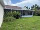 Spacious backyard featuring a screened-in porch for outdoor dining and entertaining at 5118 Laval Dr, Orlando, FL 32839