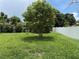 Lush backyard with green lawn and privacy fence, enhancing outdoor enjoyment at 5118 Laval Dr, Orlando, FL 32839
