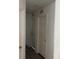 A bright hallway showing two closed doors, providing access to various rooms at 5118 Laval Dr, Orlando, FL 32839