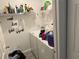 A functional laundry room with shelving, washer, and dryer ready for everyday use at 5118 Laval Dr, Orlando, FL 32839