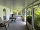 A screened patio with seating and natural light to amplify a relaxing outdoor experience at 5118 Laval Dr, Orlando, FL 32839