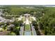 Expansive aerial view of the community center, trees, lush landscaping and neighborhood at 5669 New Independence Pkwy, Winter Garden, FL 34787