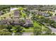 Aerial view of the homes in a neighborhood and a pond at 5669 New Independence Pkwy, Winter Garden, FL 34787