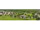 Playground surrounded by green space, walkways, trees, and parking lot in aerial view at 5669 New Independence Pkwy, Winter Garden, FL 34787