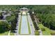 Aerial view of neighborhood with green spaces, a monument, and tree lined streets at 5669 New Independence Pkwy, Winter Garden, FL 34787
