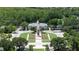 Community center features a clock tower, green space, trees, and parking in aerial view at 5669 New Independence Pkwy, Winter Garden, FL 34787