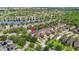 Aerial view of neighborhood with lakes, houses and green space at 5669 New Independence Pkwy, Winter Garden, FL 34787