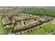 Aerial view of a neighborhood with sidewalks, driveways, lush green landscaping, and wooded areas at 5669 New Independence Pkwy, Winter Garden, FL 34787