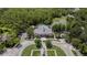 Aerial view shows the community center, pool, parking, pond, trees and lush landscaping at 5669 New Independence Pkwy, Winter Garden, FL 34787