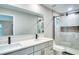 Modern bathroom featuring double vanity sinks and a spacious glass-enclosed shower at 5938 Marlberry Dr, Orlando, FL 32819