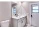 Updated bathroom with white vanity, marble countertop, and modern fixtures at 5938 Marlberry Dr, Orlando, FL 32819