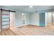 Bright bedroom featuring wood floors and access to an ensuite bathroom and closet at 5938 Marlberry Dr, Orlando, FL 32819