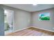 This bedroom includes wood flooring, a closet, and ensuite bathroom at 5938 Marlberry Dr, Orlando, FL 32819