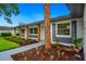 Charming single-story home with a beautifully landscaped front yard, walkway, and elegant exterior colors at 5938 Marlberry Dr, Orlando, FL 32819