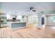 Open living area featuring modern kitchen, open floorplan, and abundant natural light throughout home at 5938 Marlberry Dr, Orlando, FL 32819