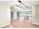 Large living space that opens to a modern kitchen featuring lots of natural light and modern fixtures at 5938 Marlberry Dr, Orlando, FL 32819