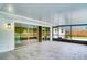 Covered patio with tile flooring and a view of the glass sliding doors leading to the pool in the backyard at 5938 Marlberry Dr, Orlando, FL 32819