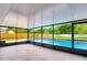 Screened-in patio featuring tile flooring, a covered ceiling, and views of the backyard with a sparkling blue swimming pool at 5938 Marlberry Dr, Orlando, FL 32819