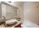 Bathroom with a granite countertop, decorative mirror, and shower/tub combination at 6138 Greatwater Dr, Windermere, FL 34786