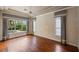 Spacious bedroom with hardwood floors, large windows, and stylish window treatments at 6138 Greatwater Dr, Windermere, FL 34786