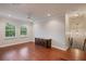 Bonus room featuring hardwood floors, two windows, and a storage cabinet at 6138 Greatwater Dr, Windermere, FL 34786