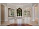 Inviting foyer with tile floors, an ornate front door, and views into other rooms at 6138 Greatwater Dr, Windermere, FL 34786