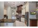 Luxury kitchen with custom cabinets, stainless steel appliances, and a center island with granite countertops at 6138 Greatwater Dr, Windermere, FL 34786
