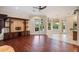 Spacious living room featuring hardwood floors and a custom built-in entertainment center at 6138 Greatwater Dr, Windermere, FL 34786