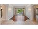 Open living room with hardwood floors, decorative lighting, and glass doors leading to the outdoors at 6138 Greatwater Dr, Windermere, FL 34786