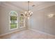 Elegant room with tile floors, decorative lighting, and arched windows offering a peaceful view at 6138 Greatwater Dr, Windermere, FL 34786