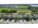 Beautiful aerial view of residential neighborhood with lush landscaping and a nearby lake at 617 Marsh Reed Dr, Winter Garden, FL 34787