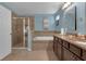 Bathroom featuring a soaking tub, shower, and dual vanity with granite countertops at 617 Marsh Reed Dr, Winter Garden, FL 34787