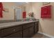 Granite vanity provides the focal point in this well-appointed bathroom at 617 Marsh Reed Dr, Winter Garden, FL 34787