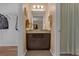 Bathroom view of a vanity with granite countertops, and a shower and tub combo with a curtain at 617 Marsh Reed Dr, Winter Garden, FL 34787