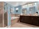Bright bathroom featuring a soaking tub, granite countertops, dual sinks, and a glass enclosed shower at 617 Marsh Reed Dr, Winter Garden, FL 34787