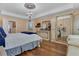 This primary bedroom features luxury décor, chandelier lighting, and decorative furnishings at 617 Marsh Reed Dr, Winter Garden, FL 34787