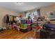 Cluttered bedroom with hardwood floors and many personal items at 617 Marsh Reed Dr, Winter Garden, FL 34787
