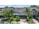 Beautiful two-story home with a paver driveway, lush landscaping, and a two-car garage at 617 Marsh Reed Dr, Winter Garden, FL 34787