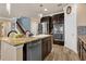 Open kitchen with stainless appliances, granite countertops and island seating at 617 Marsh Reed Dr, Winter Garden, FL 34787