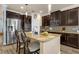 Spacious kitchen features stainless steel appliances, granite countertops, and pendant lighting at 617 Marsh Reed Dr, Winter Garden, FL 34787