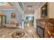 Ornate formal living area with tiled floors, fireplace, and decoratively painted ceiling at 617 Marsh Reed Dr, Winter Garden, FL 34787