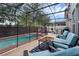 Screened-in pool area with patio furniture and well maintained patio deck at 617 Marsh Reed Dr, Winter Garden, FL 34787
