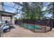 Screened-in pool with brick patio, safety fence, and comfortable seating area at 617 Marsh Reed Dr, Winter Garden, FL 34787