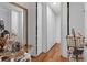 Well-organized walk-in closet featuring hardwood floors, a full length mirror and custom shelving for ample storage at 617 Marsh Reed Dr, Winter Garden, FL 34787