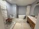 Modern bathroom with a glass enclosed shower, soaking tub, and stylish vanity at 740 Naples Dr, Orlando, FL 32804