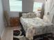 Cozy bedroom features stylish decor, laminate floors and good light at 740 Naples Dr, Orlando, FL 32804