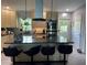 Modern kitchen features stainless appliances, a large island, and bar stool seating at 740 Naples Dr, Orlando, FL 32804